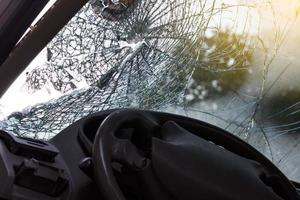 In the car, the steering wheel bent from the accident. photo