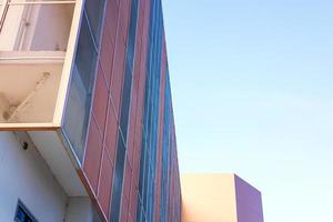 Low angle view, close-up view of a beautiful orange new building. photo