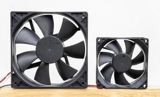 Close-up view of the two computer fans isolates of different sizes. photo