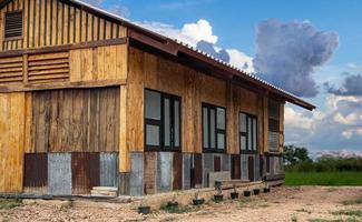 Front and side view of an old wooden house renovated into a classic modern contemporary style. photo