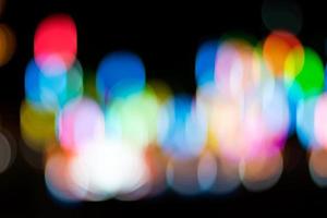Abstract blurred bokeh, lots of colorful lights in the dark. photo
