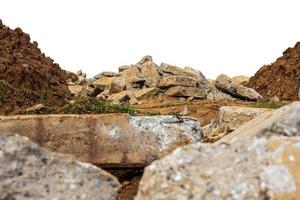 A pile of rubble isolates of concrete blocks obtained from demolition of an old road. photo