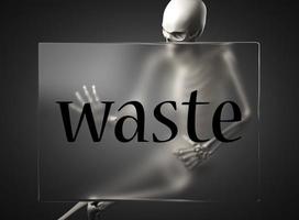 waste word on glass and skeleton photo