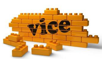 vice word on yellow brick wall photo