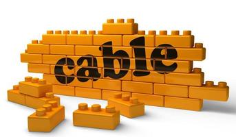 cable word on yellow brick wall photo