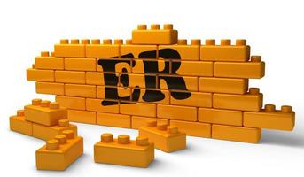 ER word on yellow brick wall photo