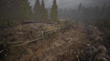 An old wood fence with a country field behind it video