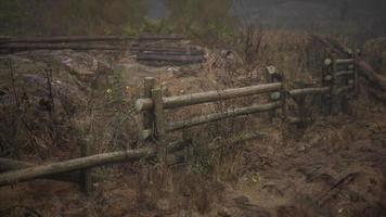 An old wood fence with a country field behind it video