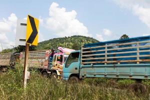 Trucks with a signpost bends. photo