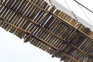 Under the old wooden bridge motorcycles. photo