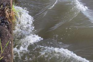 Tides flow under the bridge. photo