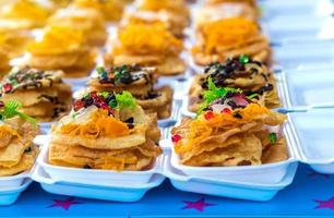 Kind of Indian food made of flour sprinkled with colorful. photo