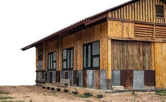 Isolate, close-up view of the front and side of an old wooden house renovated into a classic modern contemporary style. photo