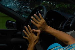 Hand holding the steering wheel accident. photo