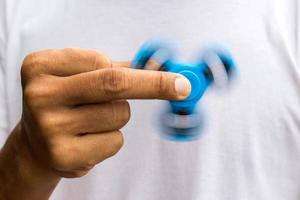 Close-up of a spinner in fingers. photo