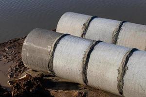 Above the concrete pipe in the canal. photo