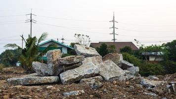 A close-up view of large concrete debris piled up on the ground. photo