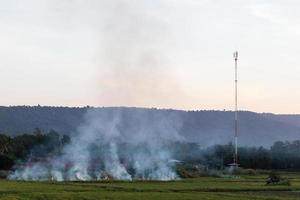 Smoke stubble burning mountain. photo