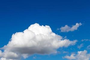 Fluffy clouds abstract shape in the blue sky. photo