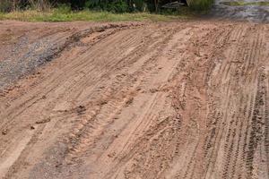 Tracks on a dirt road in the countryside. photo