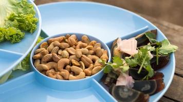Cashew nuts creatures with preserved egg. photo