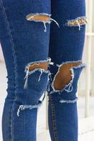 Torn jeans with jail. photo