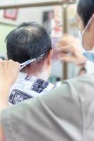 Barber hand with the back of the head. photo