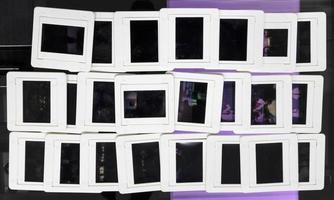 A close-up view of the background of slides of film lined in rows. photo