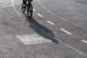 Shadow from the back of a cyclist. photo