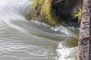 Tides flow under the bridge. photo