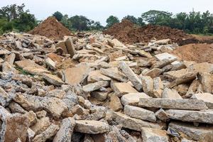 A view of the rubble of many large concrete blocks that have been demolished. photo