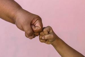 Fat woman hands fist bumps with children. photo