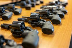 Close-up shot of .38 revolvers lined up.