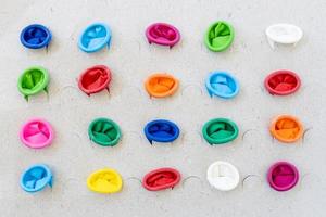 Various colors of the mouth of balloons plugged into the dull paper. photo