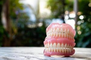 Dentures stacked with bokeh blur in a scene. photo