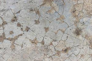 Gray cement concrete wall with cracks and mold texture background photo