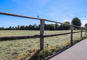 Beautiful wooden horse fence at an agricultural field photo