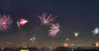 Long time exposure of fireworks over the roofs of vienna