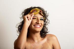 Brazilian Carnival. Young woman in costume enjoying the carnival party. photo