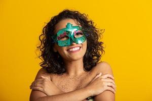 Brazilian Carnival. Young woman in costume enjoying the carnival party. photo