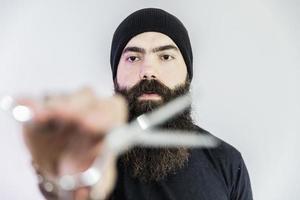 barber with long beard using scissors photo