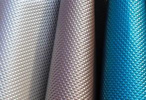 Samples of cloth and fabrics in different colors found at a fabrics market. photo