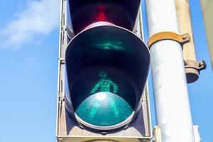 Green and red traffic lights for pedestrians and cars photo