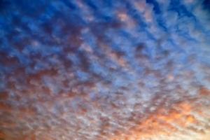 Beautiful panorama of orange and yellow clouds at sunrise photo