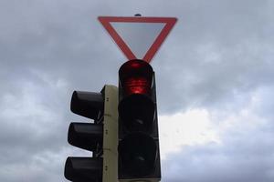 Green and red traffic lights for pedestrians and cars photo