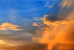 Beautiful panorama of orange and yellow clouds at sunrise photo