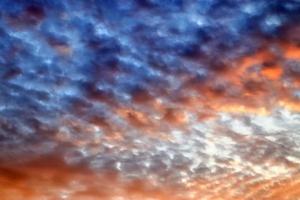 Beautiful panorama of orange and yellow clouds at sunrise photo