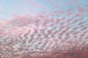 Beautiful panorama of orange and yellow clouds at sunrise photo