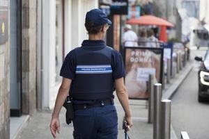 Saint Pol de Leon, France, 7-22-21-Female police officer photo