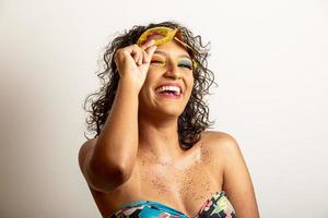 Brazilian Carnival. Young woman in costume enjoying the carnival party. photo